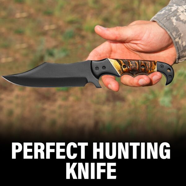 Person holding handmade carbon steel hunting knife with fire bone handle outdoors