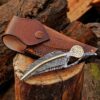 Back view of Damascus steel folding knife with feather handle and leather sheath, birthday gift for men.