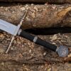 Handmade Witcher 3 inspired fantasy long sword with wall mount made from J2 steel displayed on wooden logs