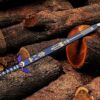 Zelda Master Sword with decorative blue scabbard on wooden background