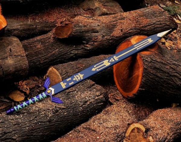 Zelda Master Sword with decorative blue scabbard on wooden background