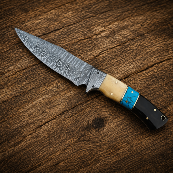 Handmade Damascus knife with turquoise handle on rustic wooden background