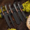 Handmade black forged 5-piece chef knife set with leather knife roll and hardwood handles. Professional kitchen knife collection, gift for him, husband, wedding, anniversary, Father's Day, Christmas, and housewarming.