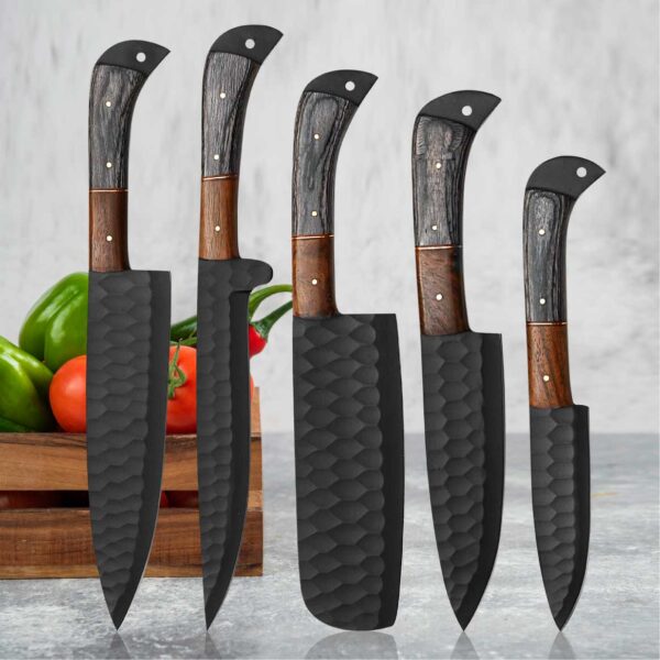 Professional 5-piece handmade black forged chef knife set displayed with vegetables. Premium kitchen knife collection, gift for him, anniversary gift, wedding gift, Father's Day, Christmas, and housewarming.