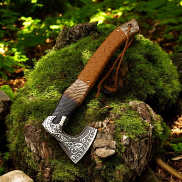 18 inch handmade Viking axe with leather wrapped handle displayed on mossy tree stump