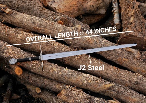 Handmade Witcher 3 inspired sword showing 44 inch overall length with J2 steel blade on wooden logs