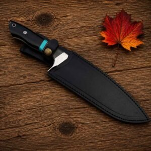 Hunting knife with handmade black leather sheath and brass fastening button