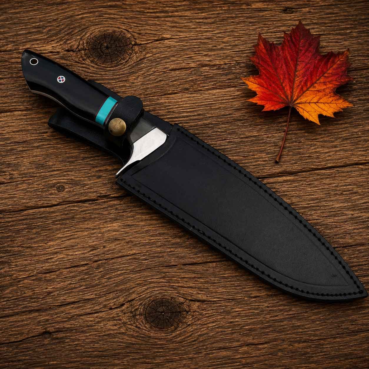 Hunting knife with handmade black leather sheath and brass fastening button