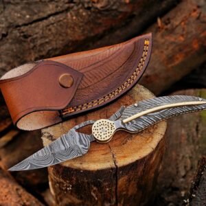 Damascus folding pocket knife with brown leather sheath on a wooden stump