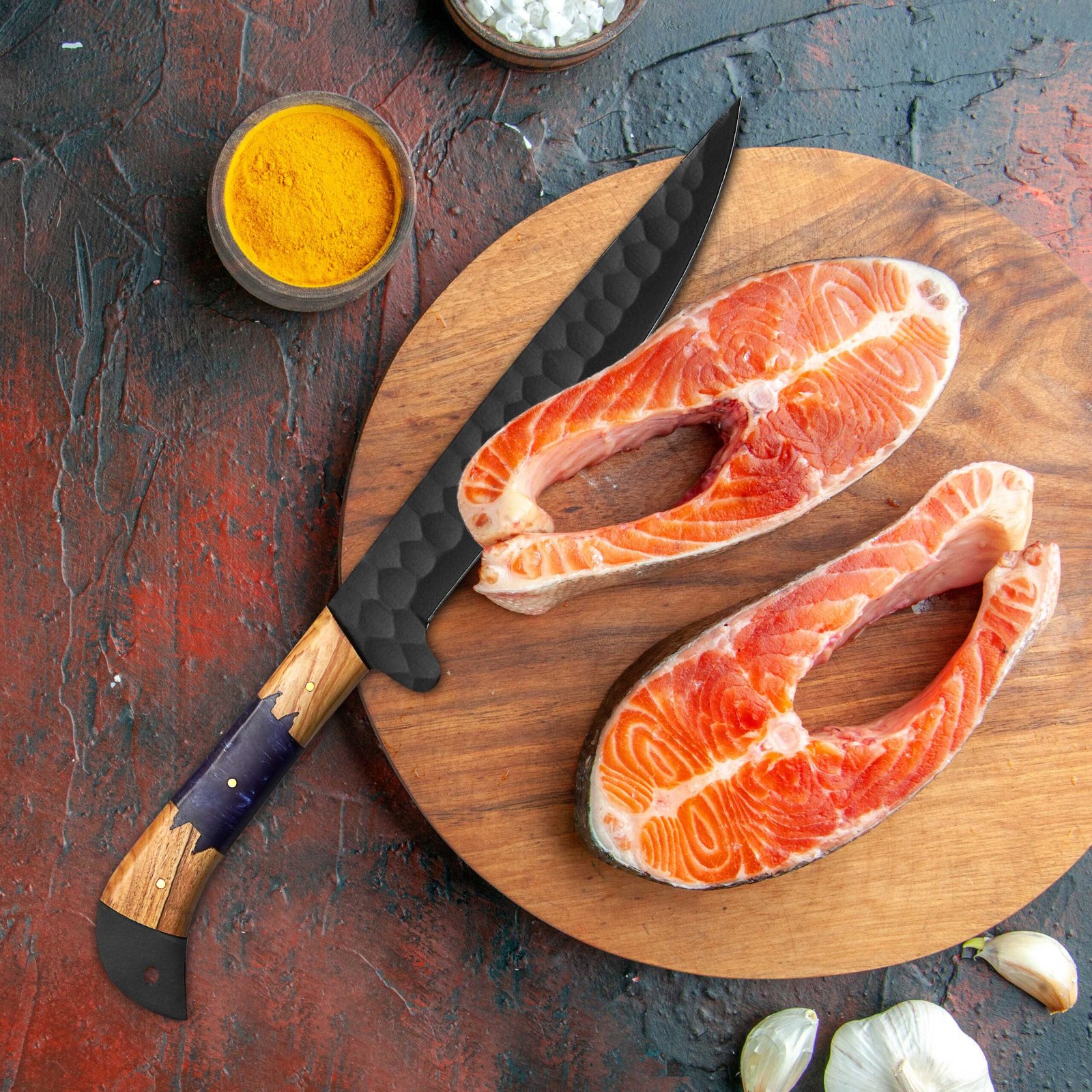 Black Powder Coated Chef Knife with Olive Wood & Resin Handle Black powder coated chef knife with olive wood and resin handle beside meat on cutting board