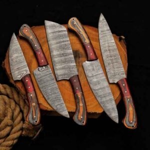 Best knife set with five handmade Damascus kitchen knives on a wooden cutting board