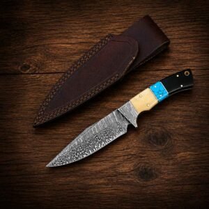 Handmade Damascus skinner hunting knife with leather sheath on dark wood