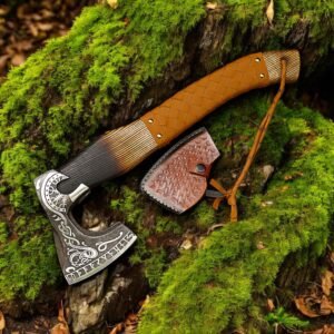 Home Handmade Viking axe with brown leather-wrapped handle and engraved axe head displayed on mossy woodland