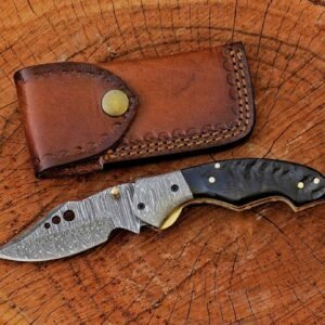 Damascus folding knife with black handle and leather sheath