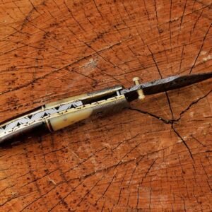 Damascus steel folding pocket knife with detailed patterned blade and handle