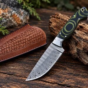 Handmade Damascus knife displayed beside its tooled leather sheath
