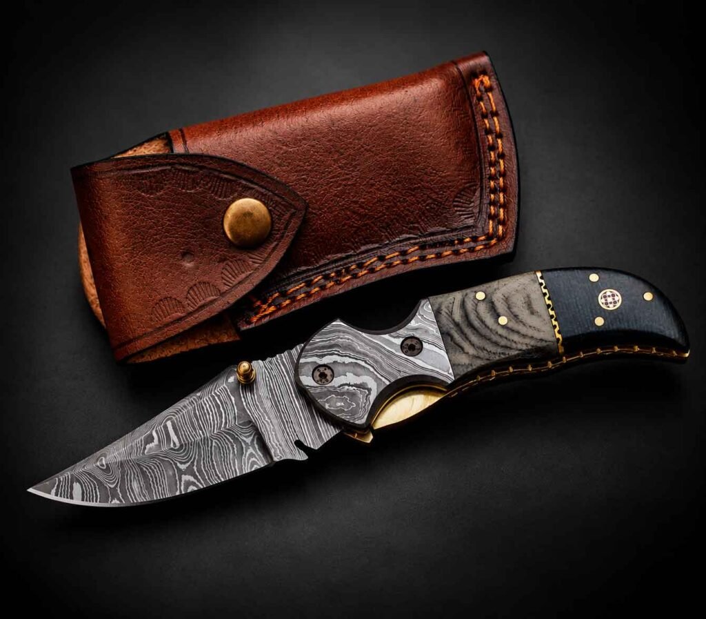 Custom Engraved Pocket Knife with detailed metal bolster and stamped brown leather sheath