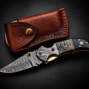 Custom Engraved Pocket Knife with detailed metal bolster and stamped brown leather sheath