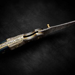 Custom Engraved Pocket Knife with ornate metalwork, patterned blade, and decorative handle